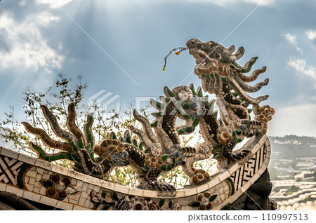 Dragon Mosaic Sculpture Adorning Pagoda Temple Rooftop, Architectural Elegance and Cultural Splendor. 110997513