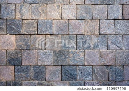 Stone tile texture. dark gray granite tile texture. rough surface, enhanced by bold burgundy accents. industrial edge into your designs, square tiles timeless backdrop Stone tile texture. dark gray granite tile texture. rough surface, enhanced by bold burgundy accents. industrial edge into your designs, square tiles timeless backdrop 110997596