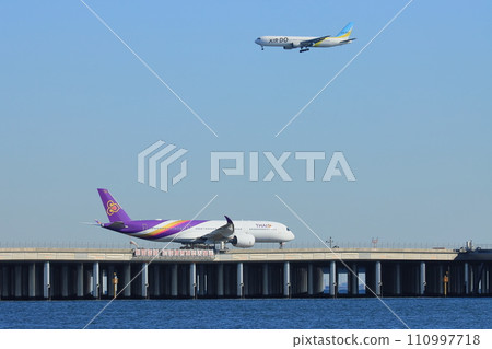 Passenger plane taking off from Runway D at Haneda Airport 110997718