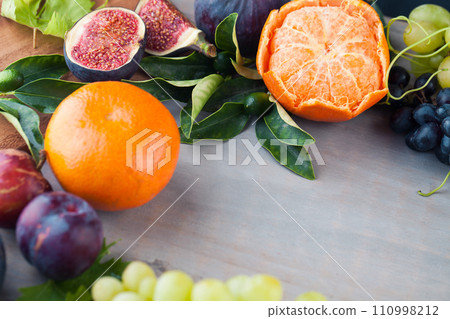 Season colorful fruit mix on light gray wooden board background with copy space Season colorful fruit mix on light gray wooden board background with copy space 110998212