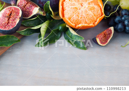 Healthy food fruit on gray wooden background. Organic fruit border Healthy food fruit on gray wooden background. Organic fruit border 110998213