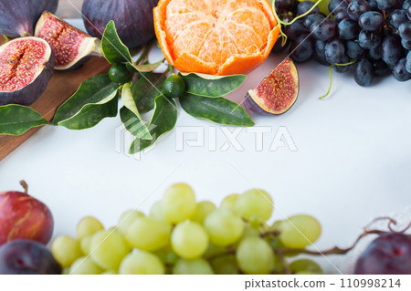 Healthy food on white background. Organic fruit mix frame border Healthy food on white background. Organic fruit mix frame border 110998214