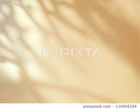 Minimalistic abstract gentle light yellow background for product presentation with light and intricate shadow from tree branches on wall  110998284