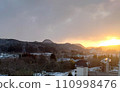 Snow-covered mountains and city 110998476