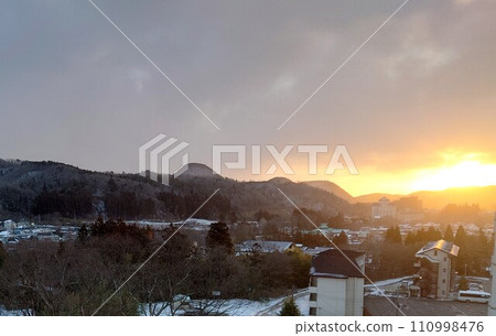 Snow-covered mountains and city 110998476