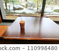 table and chairs by the window 110998480