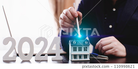 businessman buying property in 2024 using digital technology and laptop computer. Finance and trade concept 2024. Double exposure businessman buying property in 2024 using digital technology and laptop computer. Finance and trade concept 2024. Double exposure 110998621