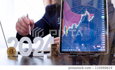 businessman buys gold and bitcoin in 2024 using digital technology and laptop computer. Finance and trade concept 2024. 110998629