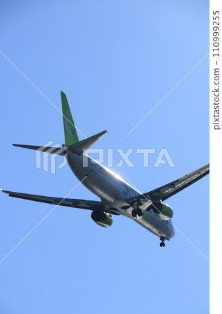 A passenger plane that shines metallic A passenger plane that shines in the backlight A passenger plane that shines metallic A passenger plane that shines in the backlight 110999255