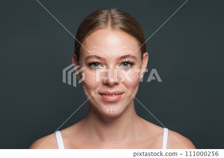 Cheerful woman. Face lift anti-aging lines on young female face.  111000256