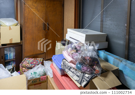 Storage room (closet) in an old house with lots of things Storage room (closet) in an old house with lots of things 111002734