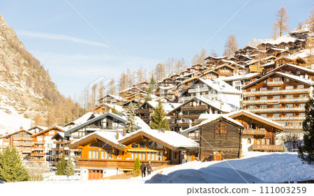 Winter mountain landscape. Snowy mountain Matterhorn during the day in winter. Zermatt, swiss alps Winter mountain landscape. Snowy mountain Matterhorn during the day in winter. Zermatt, swiss alps 111003259