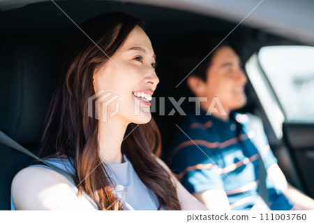 young couple enjoying a drive 111003760