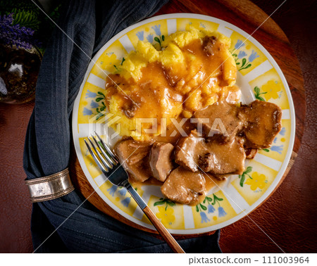 Stewed pork tongues in mustard gravy. Stewed pork tongues in mustard gravy. 111003964