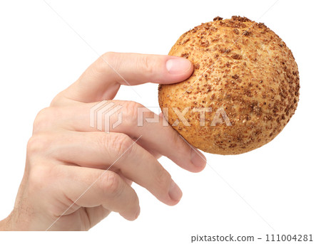 Human hand holding small wheat bun Human hand holding small wheat bun 111004281