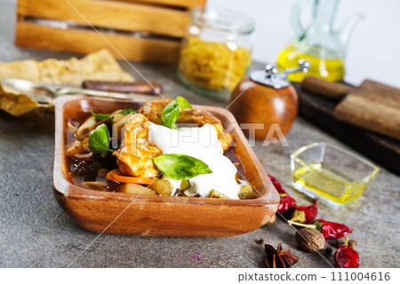 Butter chicken curry. baked chicken with sauce 111004616