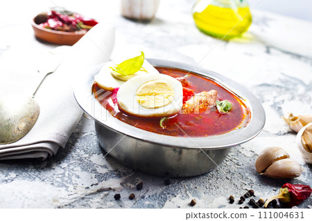 Traditional Ukrainian Russian borscht . Bowl of red beet root soup borsch with boiled egg Traditional Ukrainian Russian borscht . Bowl of red beet root soup borsch with boiled egg 111004631