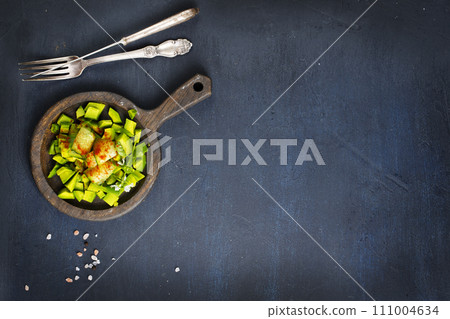 Diet avocado salad with cucumber and green onions Diet avocado salad with cucumber and green onions 111004634