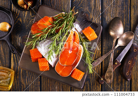 Salmon. Fresh raw salmon fish fillet with cooking ingredients Salmon. Fresh raw salmon fish fillet with cooking ingredients 111004733