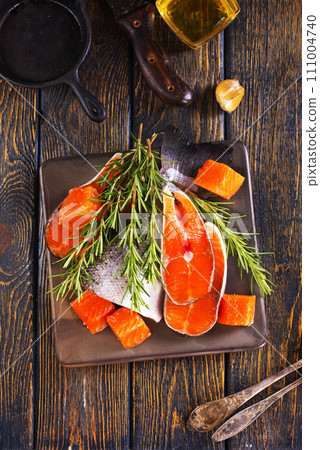 Salmon. Fresh raw salmon fish fillet with cooking ingredients 111004740