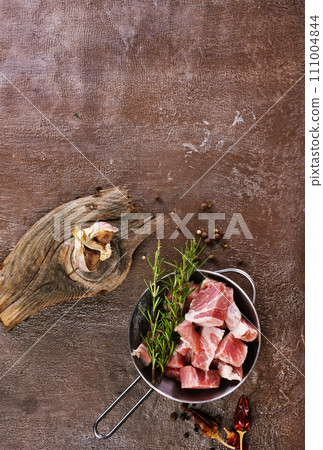 Raw organic meat ( beef or lamb ) in metal bowl Raw organic meat ( beef or lamb ) in metal bowl 111004844