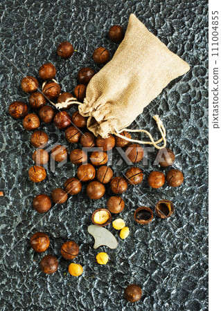 Organic Macadamia nut on wooden table, helthy food 111004855