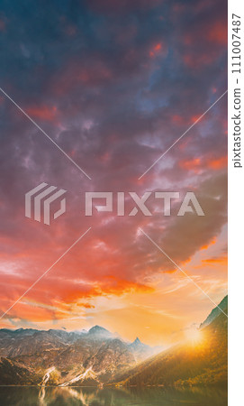 Tatra National Park, Poland. Famous Mountains Lake Morskie Oko Or Sea Eye Lake In Summer Evening. Beautiful Sun Sunset Sunrays Above Tatras Lake Landscape 111007487