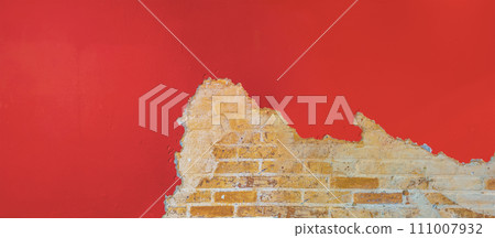 Structure of an old wall. Old brick wall with peeling plaster Structure of an old wall. Old brick wall with peeling plaster 111007932