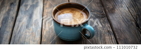 Cup of aromatic coffee cappuccino on a brown wooden background 111010732