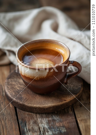 Cup of aromatic coffee cappuccino on a brown wooden background 111010739