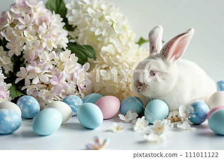 Bunny surrounded by pastel colored eggs and blooming hydrangeas 111011122