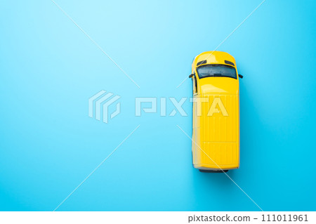 Yellow delivery van top view. Delivery of goods and cargo within the city. E-commerce, retail, or other industries on efficient distribution networks. Delivering goods and services 111011961