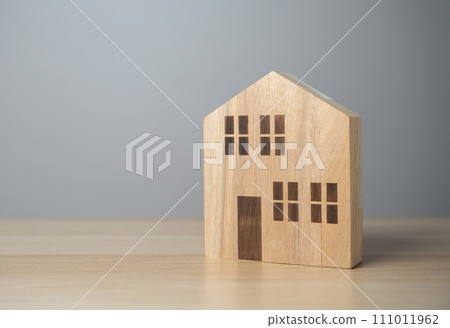 Wooden house figurine. Affordable housing. Buying a nice house. Garden work, landscape design. Figurine. Mortgage and loan. 111011962
