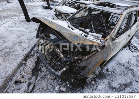 Kyiv, Ukraine - January 3, 2024: Burned civilians cars after a Russian's missiles attack 111012587