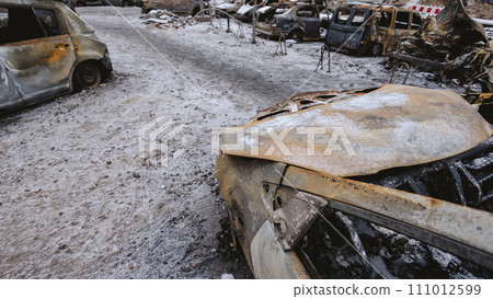 Kyiv, Ukraine - January 3, 2024: Burned civilians cars after a Russian's missiles attack 111012599