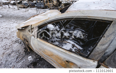 Kyiv, Ukraine - January 3, 2024: Burned civilians cars after a Russian's missiles attack 111012601
