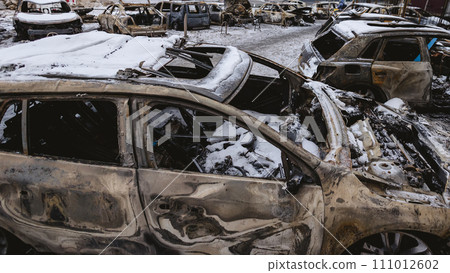 Kyiv, Ukraine - January 3, 2024: Burned civilians cars after a Russian's missiles attack 111012602