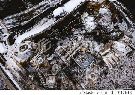 Kyiv, Ukraine - January 3, 2024: Burned civilians cars after a Russian's missiles attack Kyiv, Ukraine - January 3, 2024: Burned civilians cars after a Russian's missiles attack 111012618