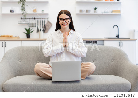 Woman with hands in namaste gesture relieve stress and regaining energy. 111013618