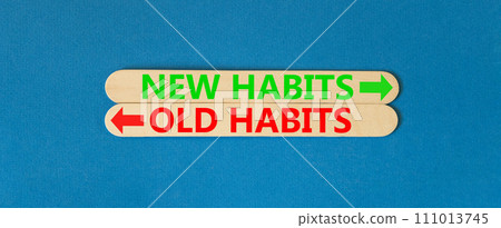 New or old habits symbol. Concept word New habits Old habits on beautiful wooden stick. Beautiful blue table blue background. Business new or old habits concept. Copy space. 111013745