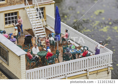 Toy people relax in miniature cafe in amusement park in Netherlands 111013823