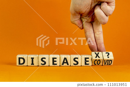 Disease X after covid symbol. Turned cubes and changed the word Disease COVID to Disease X. Beautiful orange table orange background. Doctor hand. Medical, Disease X after covid concept. Copy space. Disease X after covid symbol. Turned cubes and changed the word Disease COVID to Disease X. Beautiful orange table orange background. Doctor hand. Medical, Disease X after covid concept. Copy space. 111013951