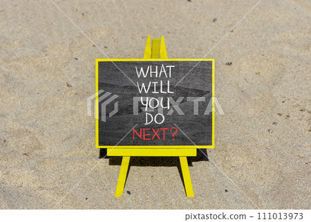 What will you do next symbol. Concept words What will you do next on beautiful blackboard. Beautiful sand beach background. Business, what will you do next concept. Copy space. 111013973