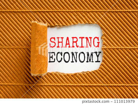 Sharing economy symbol. Concept words Sharing economy on beautiful white paper. Beautiful brown paper background. Business sharing economy concept. Copy space. 111013979