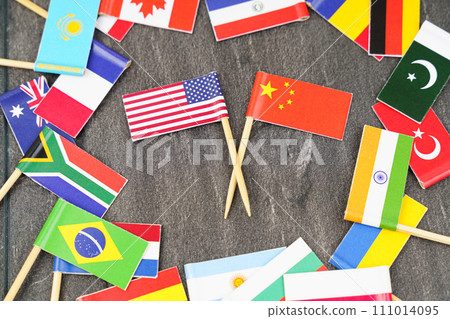 The concept is diplomacy. In the middle among the various flags are two flags - USA, China The concept is diplomacy. In the middle among the various flags are two flags - USA, China 111014095