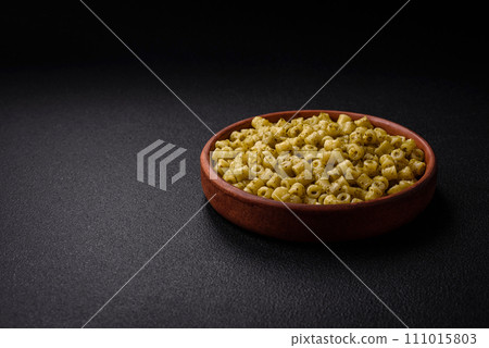 Delicious ditali pasta from durum wheat with salt and spices Delicious ditali pasta from durum wheat with salt and spices 111015803
