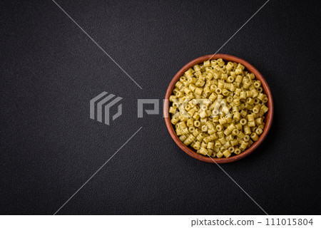 Delicious ditali pasta from durum wheat with salt and spices Delicious ditali pasta from durum wheat with salt and spices 111015804