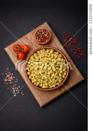 Delicious ditali pasta from durum wheat with salt and spices Delicious ditali pasta from durum wheat with salt and spices 111015809