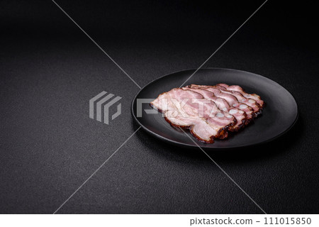 Delicious fresh pancetta or bacon with salt and spices cut into thin slices 111015850
