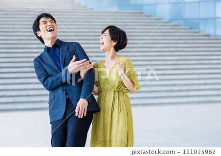 Portrait of a couple walking arm in arm Portrait of a couple walking arm in arm 111015962